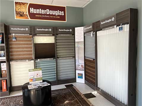 A display of multiple Hunter Douglas window coverings